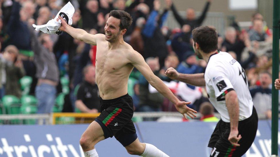 A delighted Andy Waterworth runs away in celebration after scoring the equaliser for Glentoran