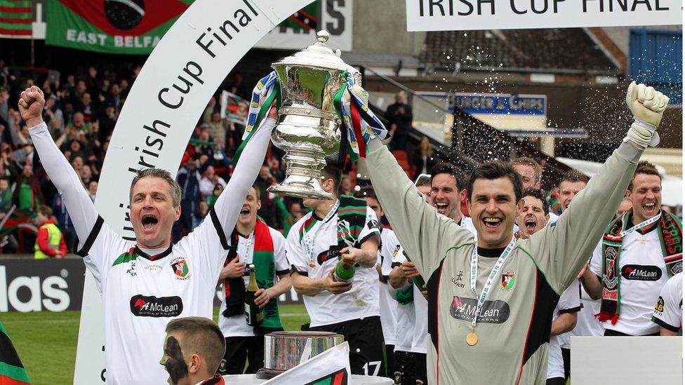 Glentoran captain Colin Nixon, who made his 794th and last appearance for the club, lifts the Irish Cup with goalkeeper Elliott Morris