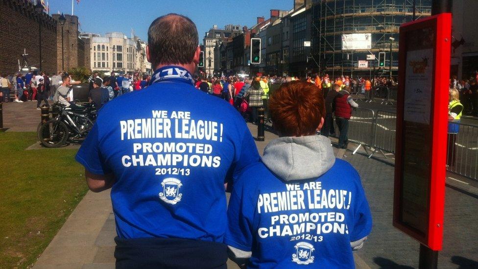 They've got the shirts - David Sherwood and son David Mico-Sherwood on their way to the champions' parade.