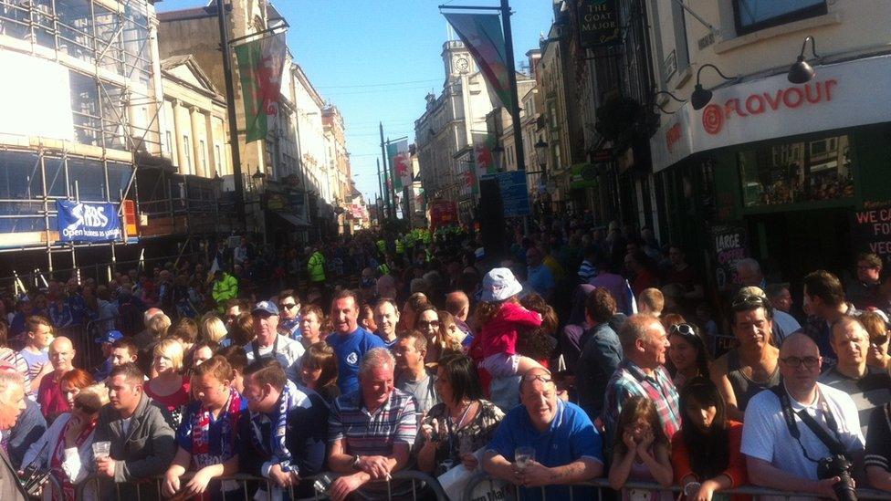 Crowds of supporters gathered in the late afternoon sunshine at Cardiff Castle waiting for the parade to start.