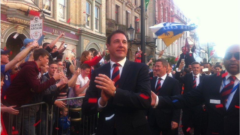 Manager Malky Mackay and members of the Cardiff City squad applauded the waiting fans as they emerged from the castle at the start of the parade.