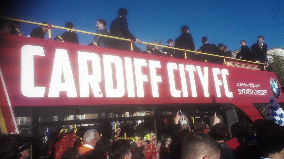 Fans accompanied the bus parade as it made its way in the late evening sunshine down to Cardiff Bay.