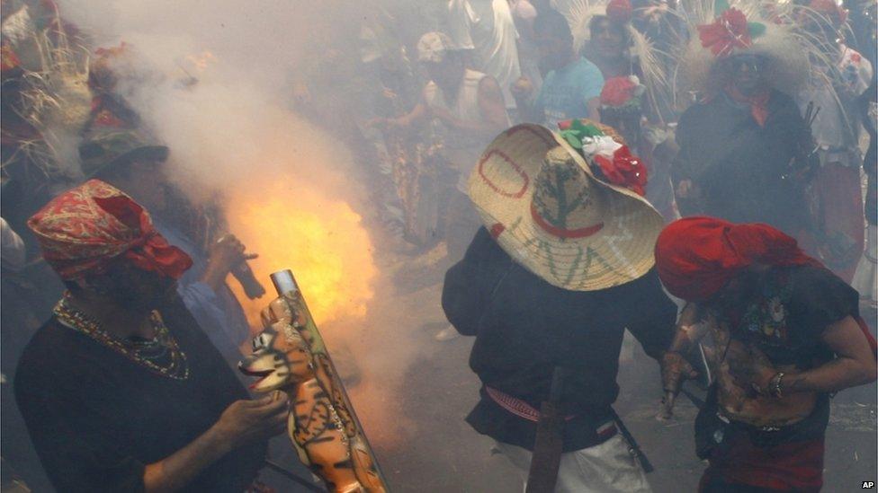 A firecracker goes off at a recreation of the battle of Puebla in Mexico City