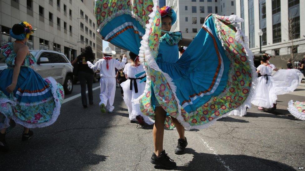 A girl dances at a Cinco de Mayo march in Denver, Colorado