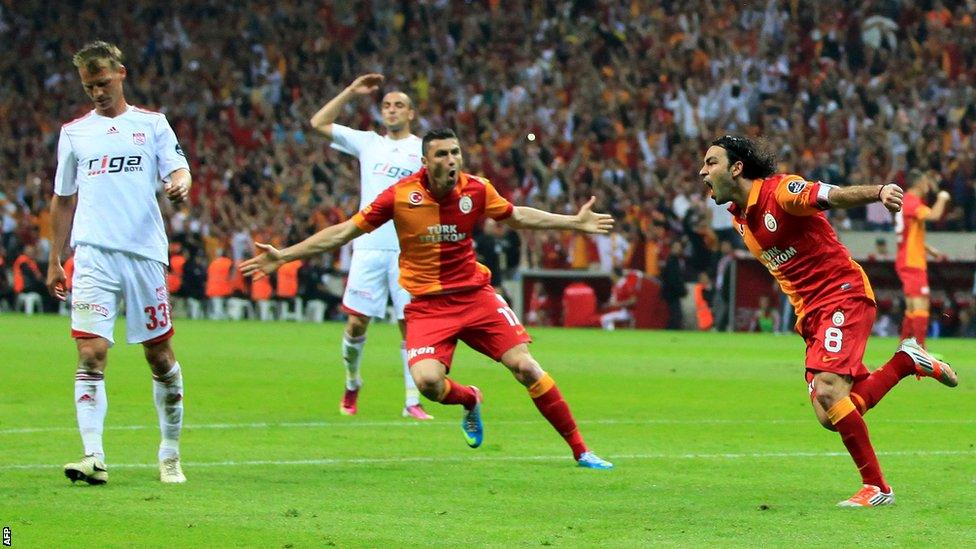 Galatasaray's Burak Yilmaz (second right) and Selcuk Inan (right) celebrate a goal in the victory against Sivasspor that sealed their club's record 19th league title