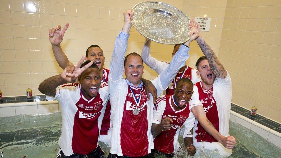 Ajax head coach Fran de Boer celebrates his club-record equalling third successive league title in a pool with his players