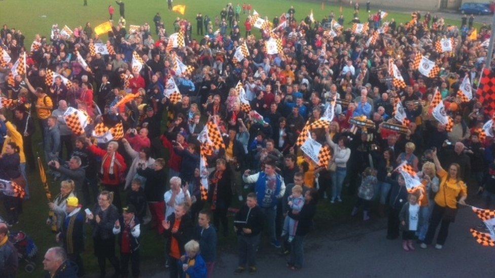 Fans cheer the team at Rodney Parade