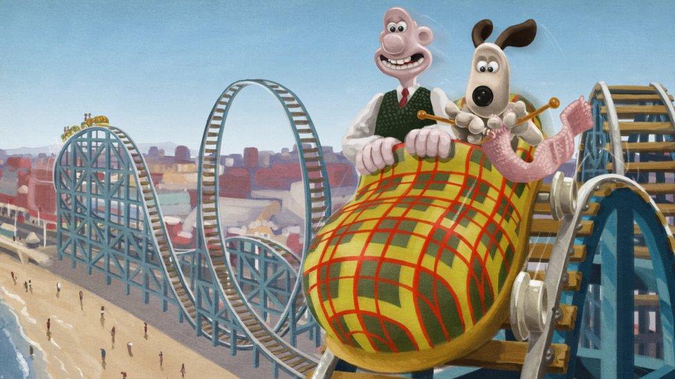 Wallace and Gromit on a rollercoaster at the seaside.