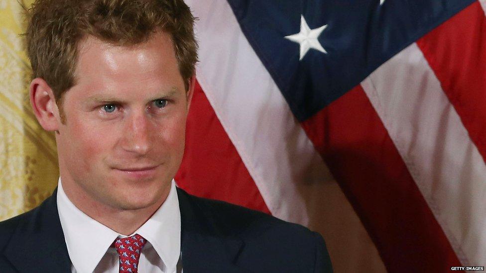 Prince Harry in front of US flag