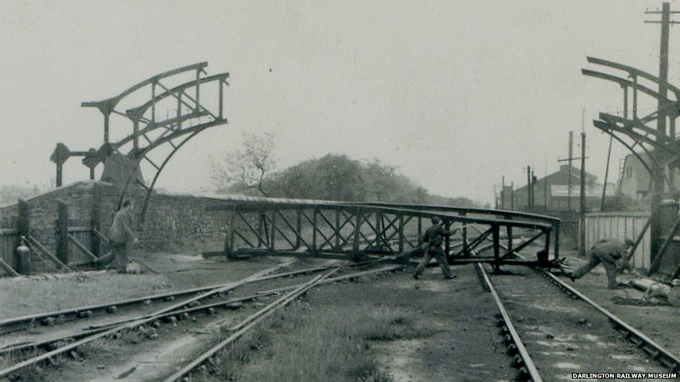 Men constructing a bridge