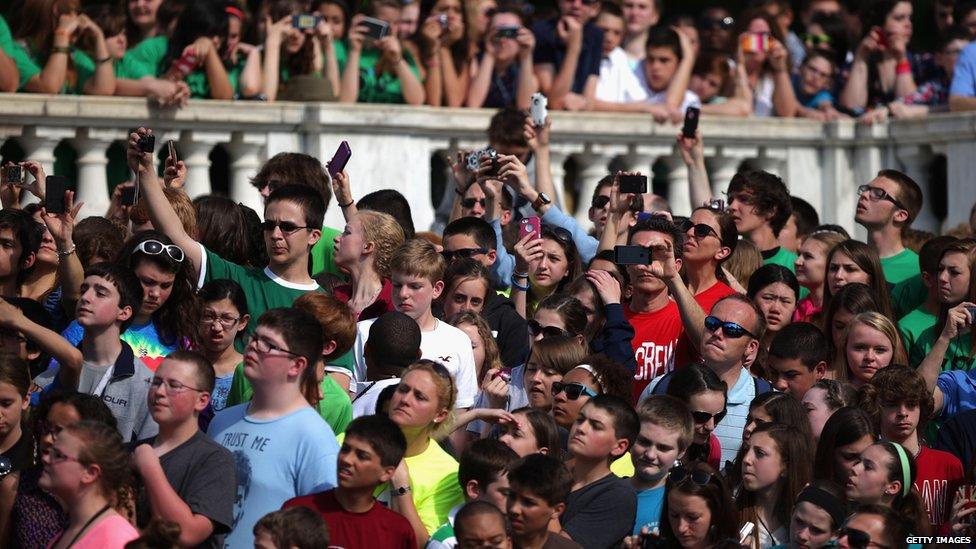 Crowd at Arlington cemetery trying to get a picture