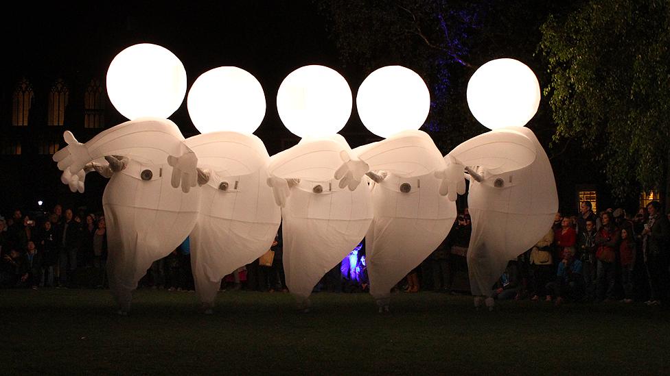 Characters from Herbert's Dream by Compagnie des Quidams performing in Norwich's Cathedral Close