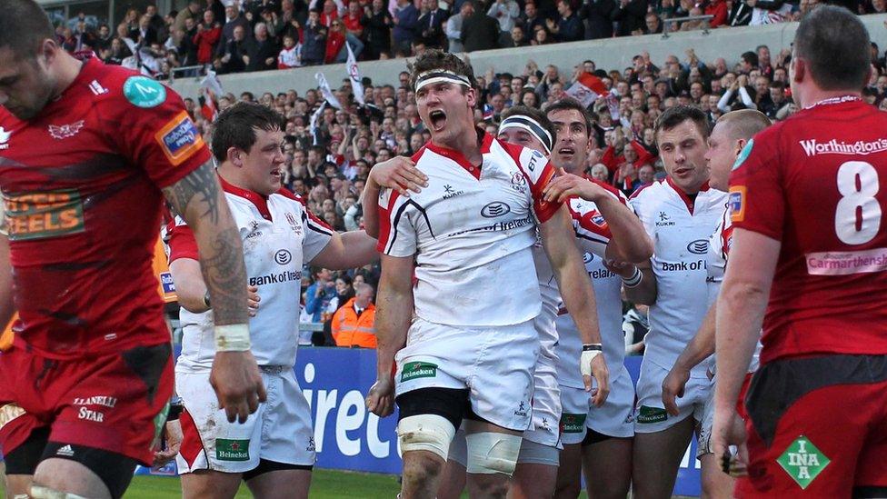 Ulster players gather to congratulate try scorer Robbie Diack after the back row scores his side's second try of the game