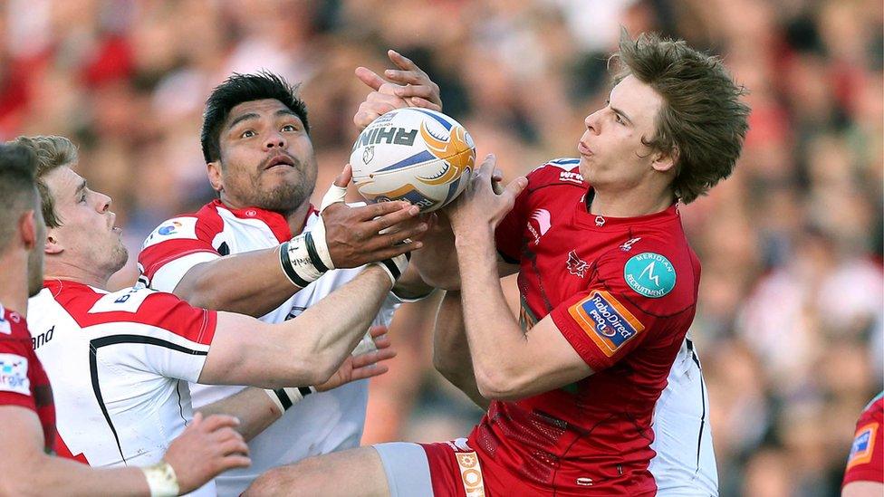 Andrew Trimble, Nick Williams and Liam Williams challenge for the ball at Ravenhill