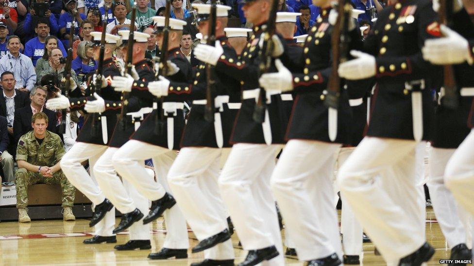 Prince Harry watching a US Marine Corps silent drill at a visit to the Warrior Games opening ceremony