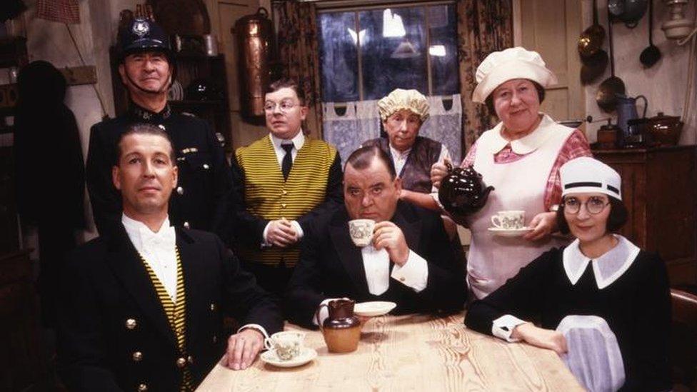 Paul Shane (centre) in You Rang, M'Lord? with co-stars (l-r) Jeffrey Holland, Bill Pertwee, Perry Benson, Barbara New, Brenda Cowling and Su Pollard