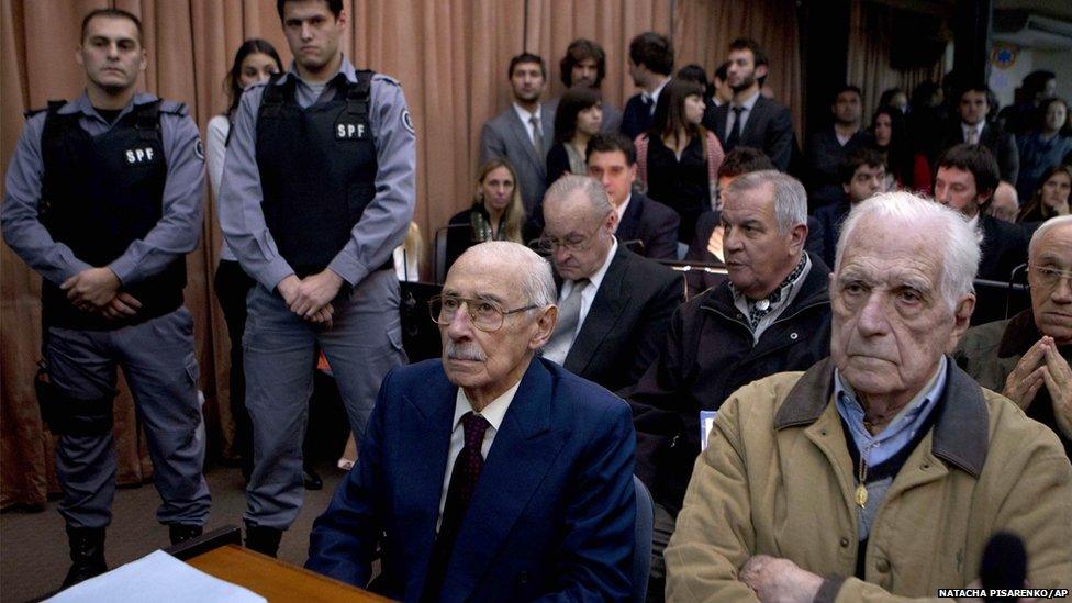 Former dictators Jorge Rafael Videla, second from right, and Reynaldo Bignone, right, wait to listen the verdict of Argentina's historic stolen babies trial in Buenos Aires, Argentina, Thursday, July 5, 2012. (AP Photo/Natacha Pisarenko)