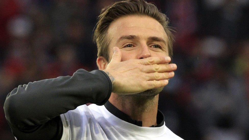 David Beckham blows a kiss to the crowd