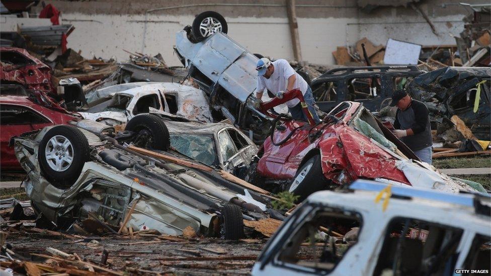 Overturned cars in Oklahoma following the huge tornado that struck on Monday, 21 May 2013