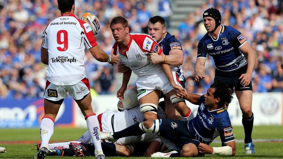 Chris Henry passes the ball to Ruan Pienaar after turning the ball over for Ulster