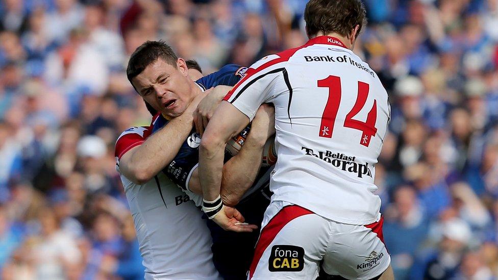 Brian O'Driscoll is stopped in his tracks by Ulster winger Andrew Trimble