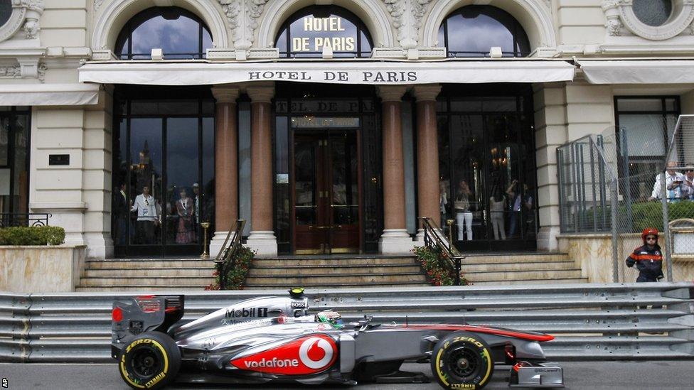 Sergio Perez drives past the Hotel De Paris in Monte Carlo