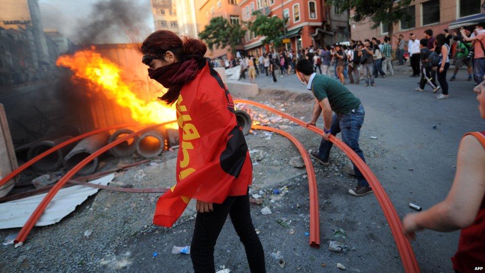 Protesters clash with Turkish riot police in the Taksim area of Istanbul.