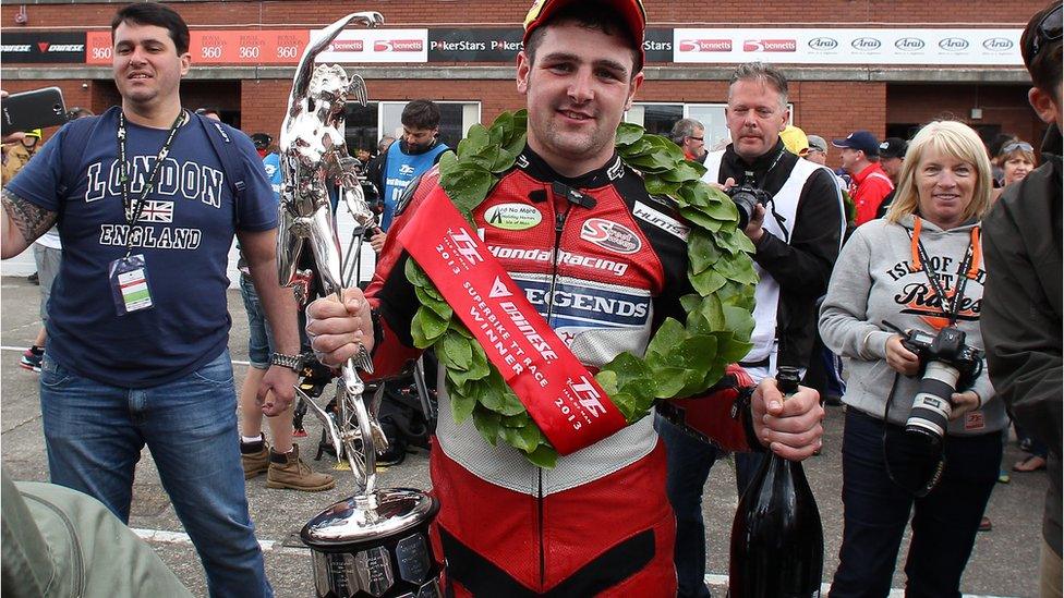 The celebrations begin for Honda Fireblade rider Michael Dunlop after his victory in the six-lap Superbike event