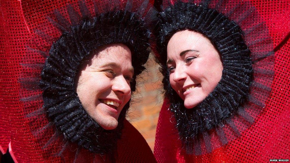 Two people dressed as poppies