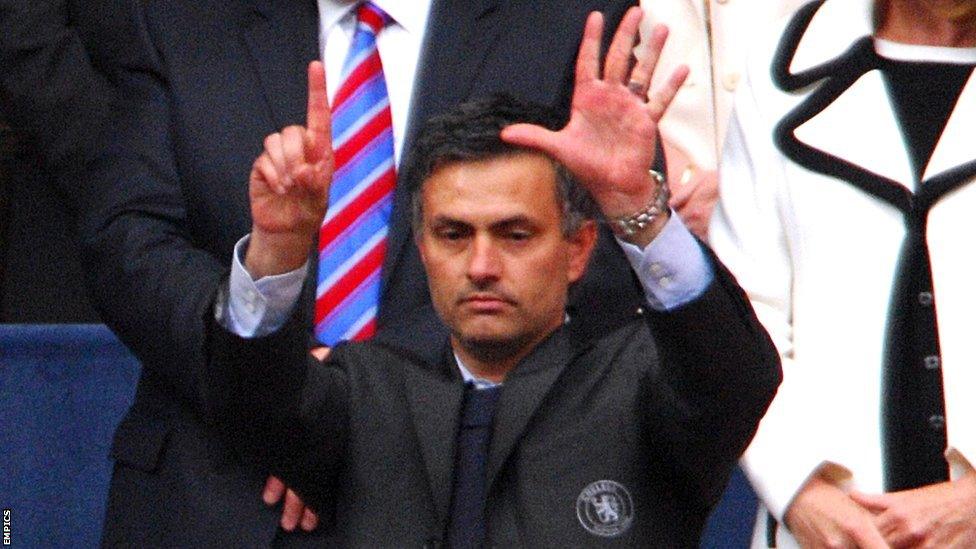 Jose Mourinho gesturing 'six' to supporters