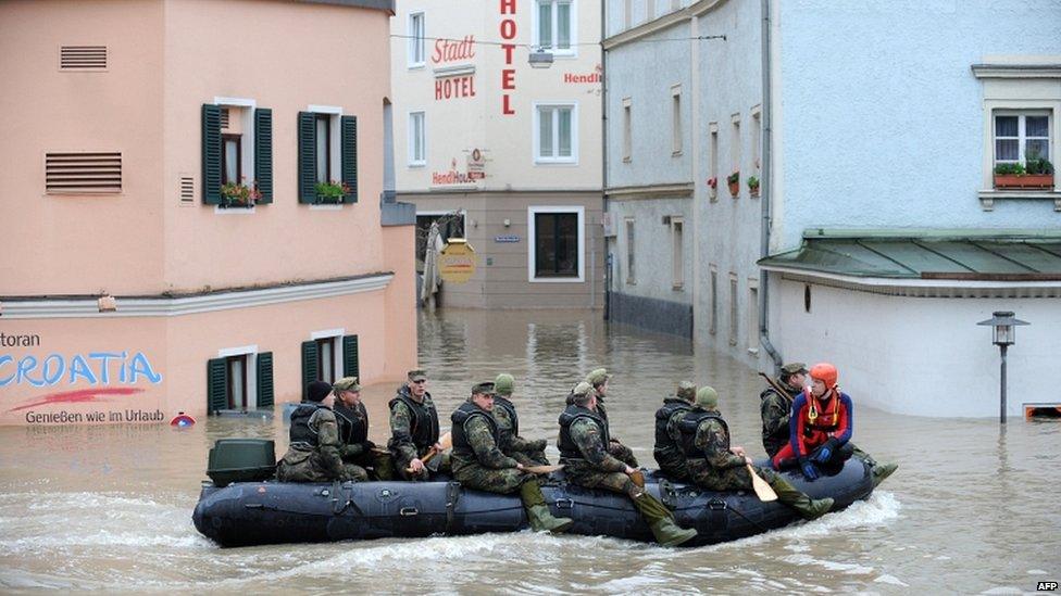 Soldiers row through flooded streets of Passau, Germany, on 4 June 2013