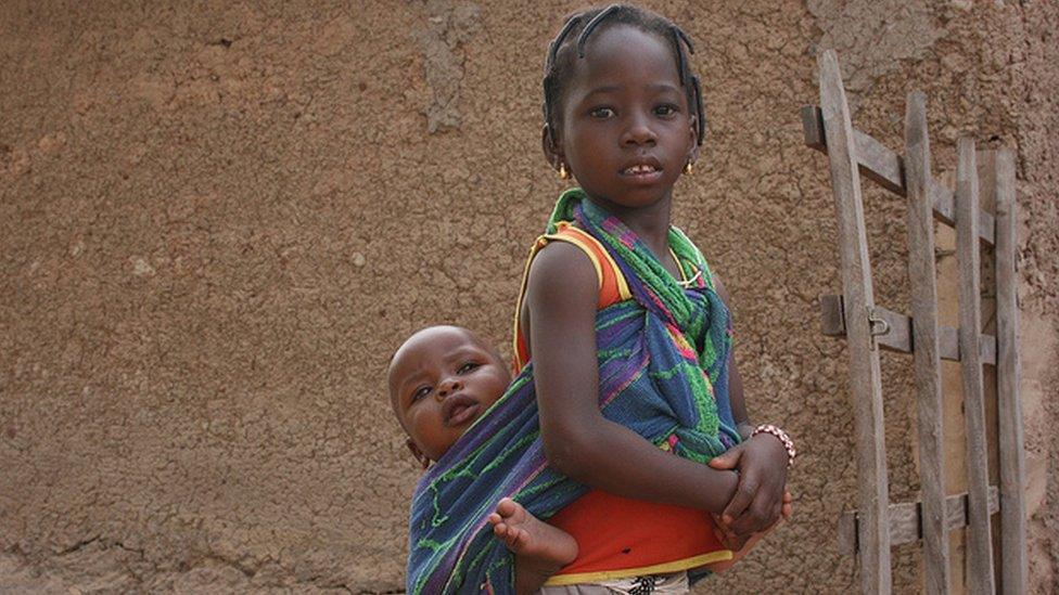 Child with baby. Photo: Alina Paul-Bossuet, Icrisat.