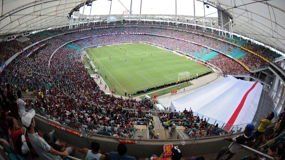 Brazilians watch a match between Esporte Club Bahia and Esporte Club Vitoria of the Baiano Championship at the "Arena Fonte Nova" stadium during its official inauguration in Salvador de Bahia, Brazil on April 7, 2013.