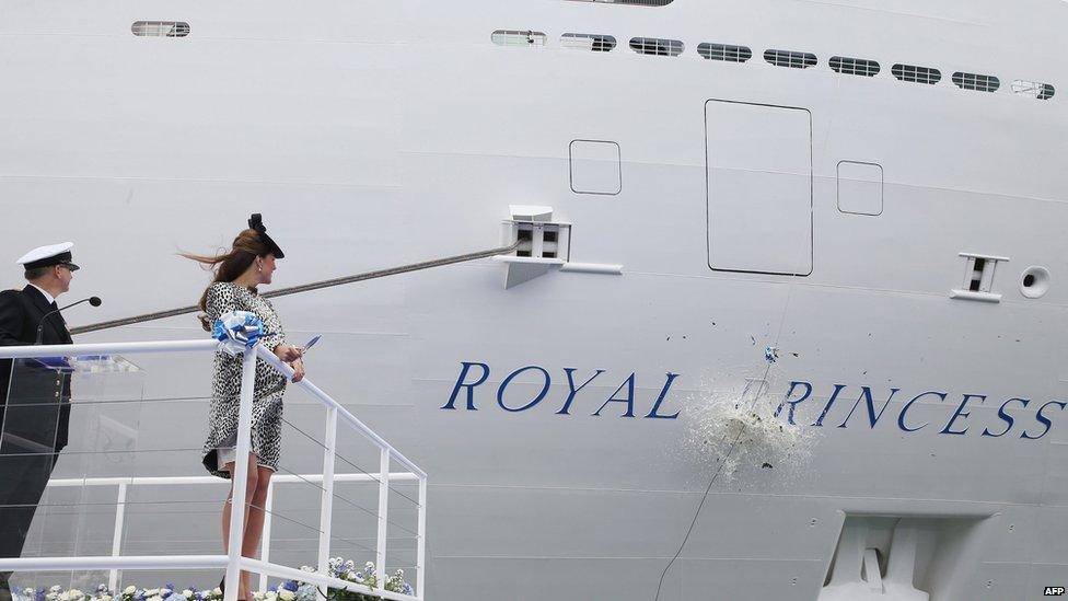 Champagne bottle smashing against Royal Princess's hull