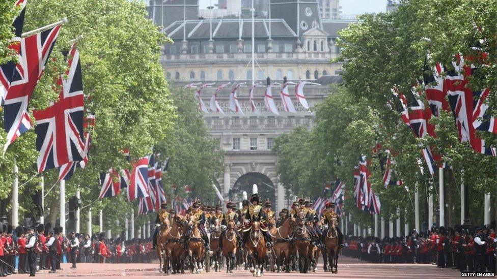 Guards march down the Mall towards Buckingham Palace during the annual Trooping the Colour Ceremony