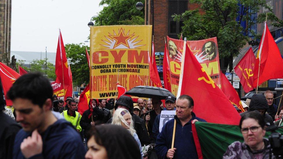 The protesters marched towards Belfast City Hall, where about 2,000 people gathered for the rally