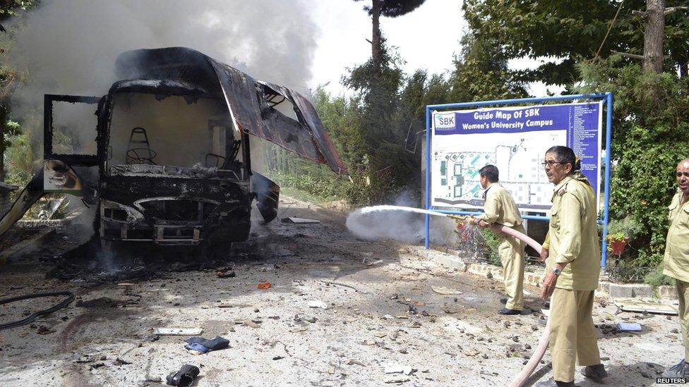 Wreckage of a bus destroyed in a university bomb blast in Quetta, Pakistan, 15 June