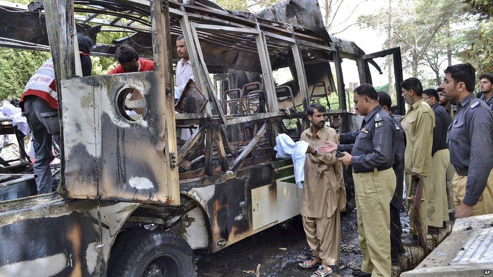 Wreckage of a bus destroyed in a university bomb blast in Quetta, Pakistan, 15 June