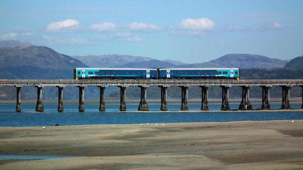 A train crossing the Mawddach estuary