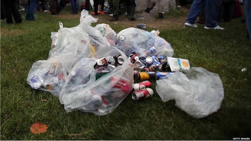 Empty cans of alcohol are collected in bags