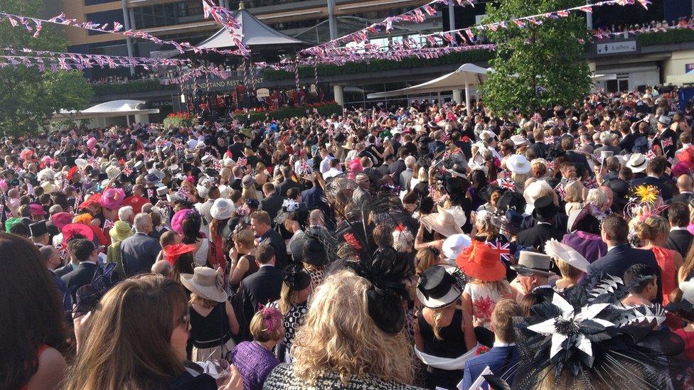 Royal Ascot racegoers gather to sing around the bandstand