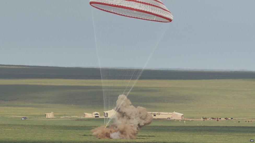 The re-entry capsule of China's Shenzhou 10 spacecraft lands in Siziwang Banner, in the Inner Mongolia Autonomous Region on 26 June 2013