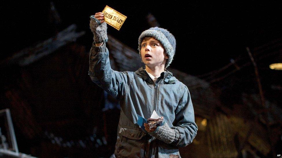 Charlie with his golden ticket