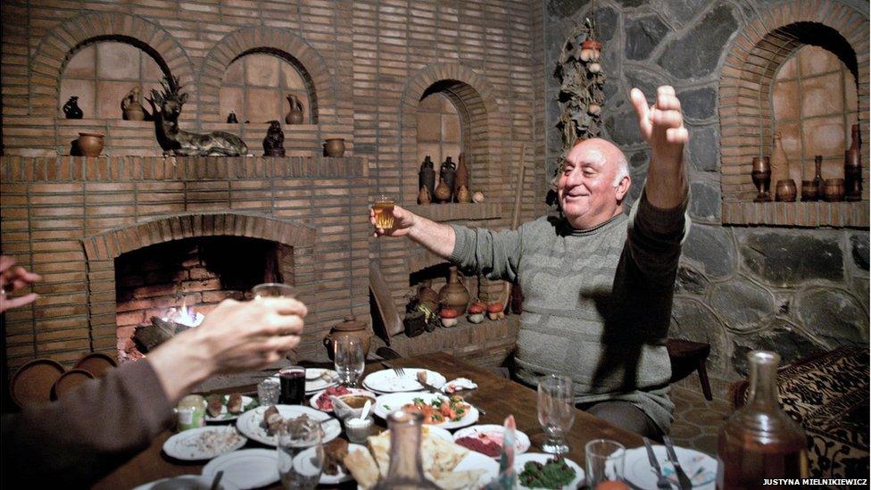 Hospitality is taken very seriously in Georgia. Here, Vazha Nikolaishvili, who runs a small agrotourism business, makes a toast with wine to his guest.