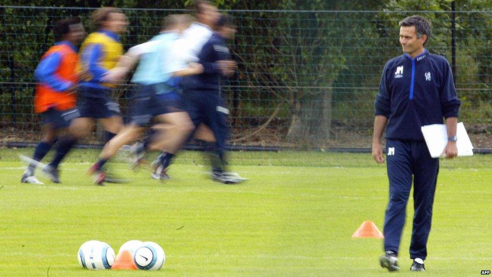 Chelsea's newly appointed manager Jose Mourinho watches his players at the training session at the club's training ground at Harlington on 5 July, 2004