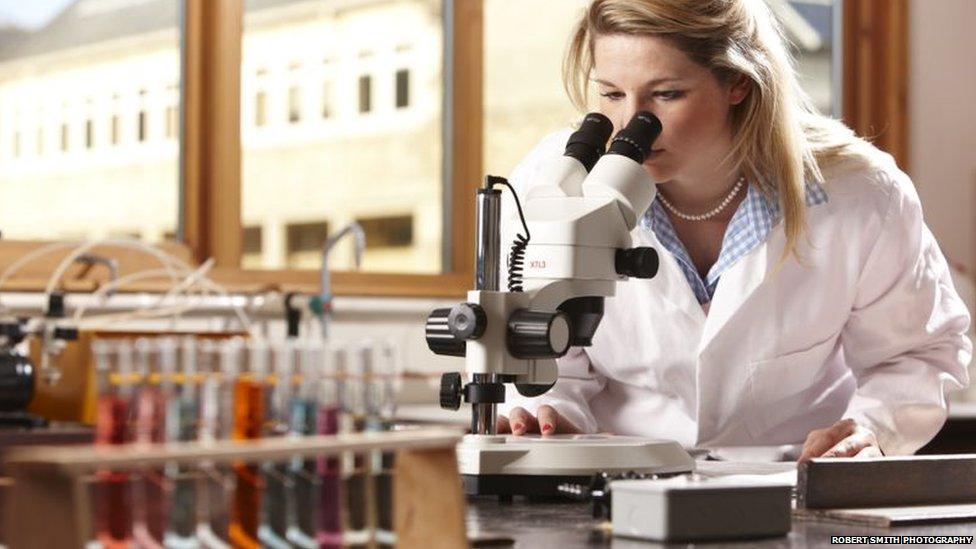 A student using a microscope