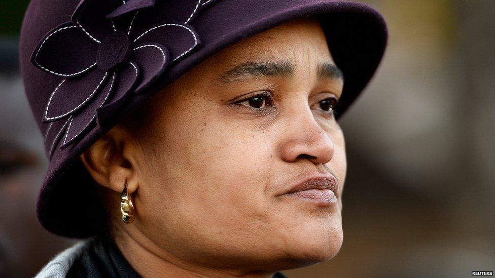 A woman weeps as she pays her respects outside the Medi-Clinic Heart Hospital, where ailing former South African President Nelson Mandela is being treated, in Pretoria on Thursday 27 June