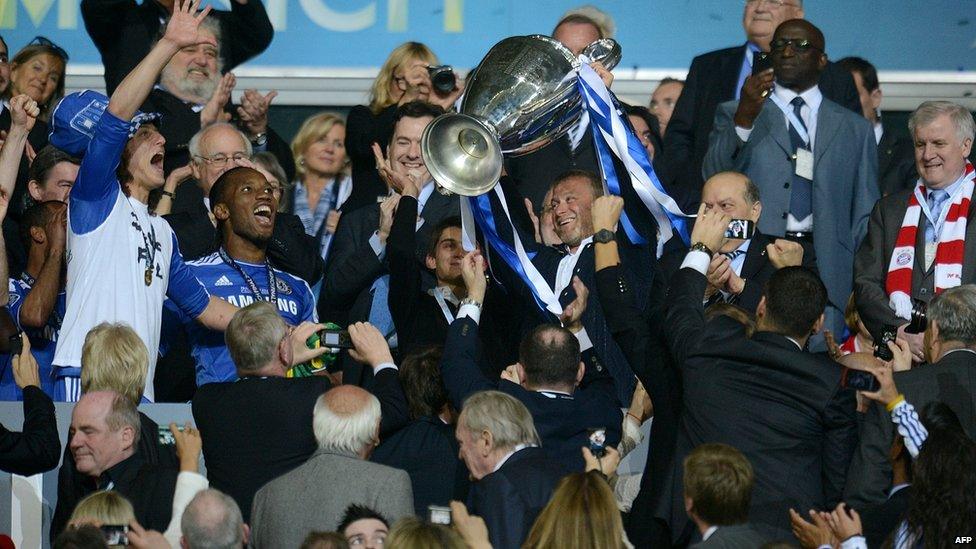 Chelsea's Russian owner Roman Abramovich holds the trophy after the UEFA Champions League final between Bayern Munich and Chelsea on 19 May, 2012 at the Fussball Arena in Munich