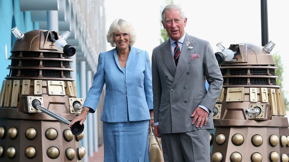 The Prince of Wales and Duchess of Cornwall and two Daleks