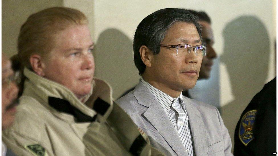 San Francisco Fire Chief Joanne Hayes-White, left, and Korean Consulate of San Francisco Dongman Han listen to speakers at a news conference after Asiana Flight 214 crashed at San Francisco International Airport in San Francisco, 6 July, 2013